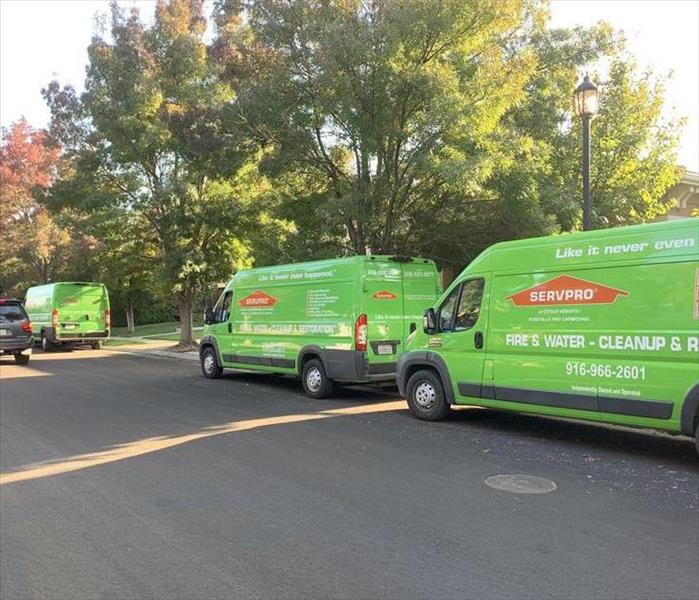 photo of SERVPRO vehicles outside of a residential area