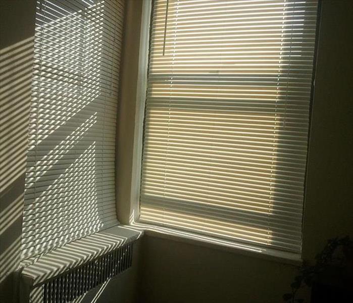 Heater with shadows from blinds and sunshine